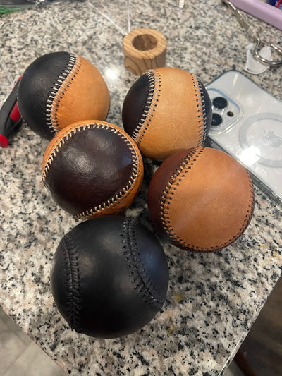 Leather baseballs on countertop